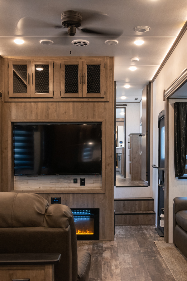 The interior of a fifth wheel with a split-level floor plan.
